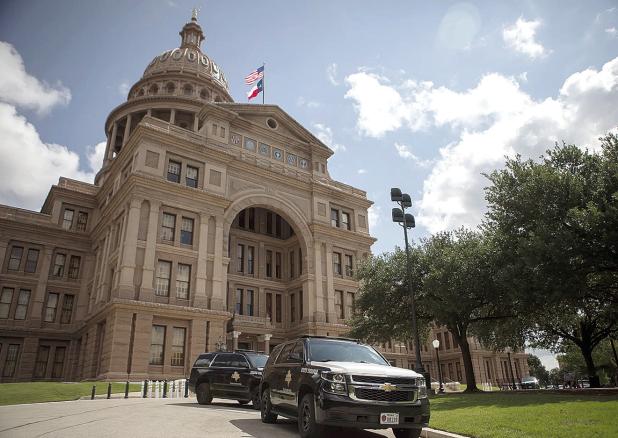 Texas Department of Public Safety vehicles outside of the state Capitol on Aug. 11, 2021. Credit: Miguel Gutierrez Jr./The Texas Tribune