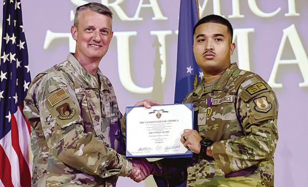 Right, Senior Airman Michael Tumang, 75th Security Forces Squadron, receives a Purple Heart from Col. Dan Cornelius, 75th Air Base Wing commander, during a ceremony April 30, 2026, at Hill Air Force Base, Utah.