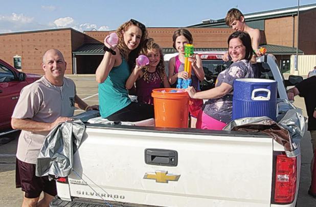 Local Neighborhood Hosts Drive-by Water Balloon War