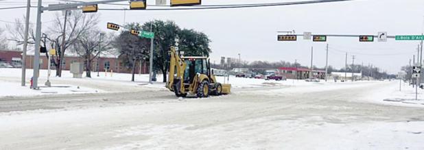 City of Forney Public Works Department Working to Clear Snow From Roadway
