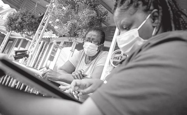 A 2020 Census representative speaks with a resident during a census campaign in New York City in 2020. Credit: Michael Appleton/Mayoral Photo