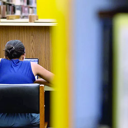 A student studies in the Perry-Castañeda Library on the UT Austin campus during finals week on April 28, 2025. Credit: Lorianne Willett/The Texas Tribune